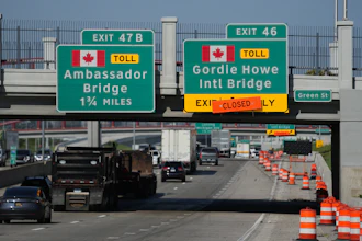 Exits from Interstate 75 are displayed for the Gordie Howe International Bridge and Ambassador Bridge connecting Windsor, Ontario, with Detroit, Tuesday, July 14, 2026,
