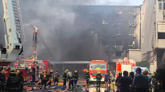 In this photo released by Xinhua News Agency, firefighters at the scene of a footwear factory fire in Jiangtou village, Chendai township of Jinjiang city, southeastern China's Fujian province, Thursday, July 9, 2026.