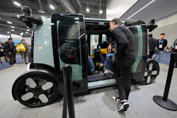 People view a Zoox self-driving vehicle at the company's booth during the CES tech show, Jan. 7, 2025, in Las Vegas.