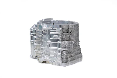 A sample metal component after partial CNC machining, demonstrating post-processing of an additively manufactured part.