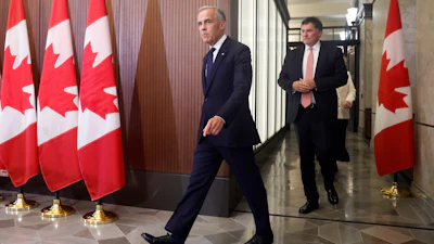 Prime Minister Mark Carney and Canada-U.S. Trade Minister Dominic LeBlanc arrive at a news conference on Parliament Hill, Ottawa, Aug. 22, 2026.