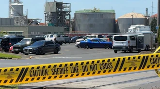 Yellow police tape is seen on May 27, 2026 outside the Longview, Wash. paper mill where a deadly chemical tank failure occurred.