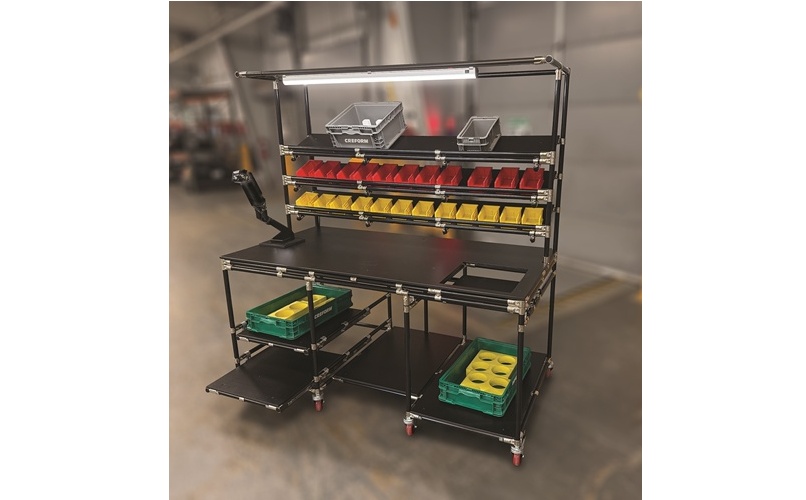 Industrial mobile workstation with tiered shelving, red and yellow storage bins, and green containers on lower shelves