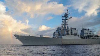 In this photo provided by U.S. Navy, Arleigh Burke-class guided-missile destroyer USS Benfold (DDG 65) conducts routine underway operations in the Philippines Sea on June 24, 2022.