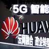 Signs promoting 5G wireless technology from Chinese technology firm Huawei are displayed at the PT Expo in Beijing on Sept. 26, 2018.