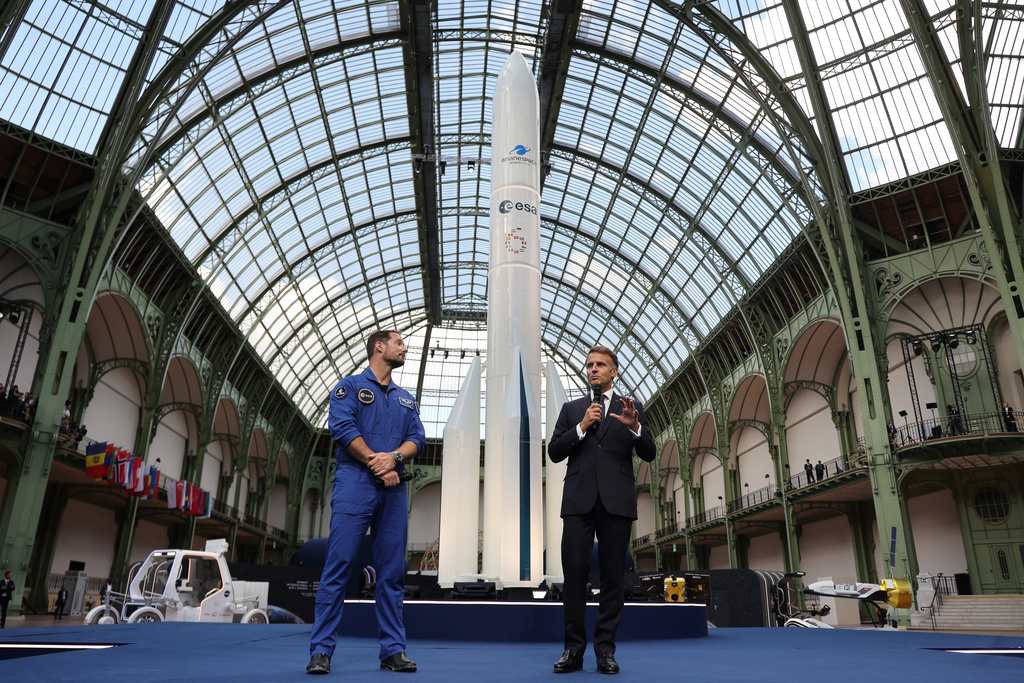 French President Emmanuel Macron, right, speaks as French European Space Agency astronaut Thomas Pesquet listens during the International Space Summit at the Grand Palais in Paris, Wednesday, Sept. 9, 2026.