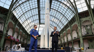 French President Emmanuel Macron, right, speaks as French European Space Agency astronaut Thomas Pesquet listens during the International Space Summit at the Grand Palais in Paris, Wednesday, Sept. 9, 2026.