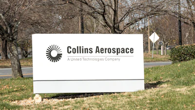 Collins Aerospace corporate sign on landscaped grounds with bare trees and road