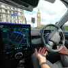 An Uber driver has his hands ready for intervention as he sits in an autonomous car in London, Tuesday, Sept. 1, 2026 as Uber officially launches the first hailable autonomous cabs in London.