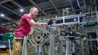 A worker at GM’s Flint Engine Operations, where the all-new Gen-6 5.7L and 6.6L V8s are assembled.