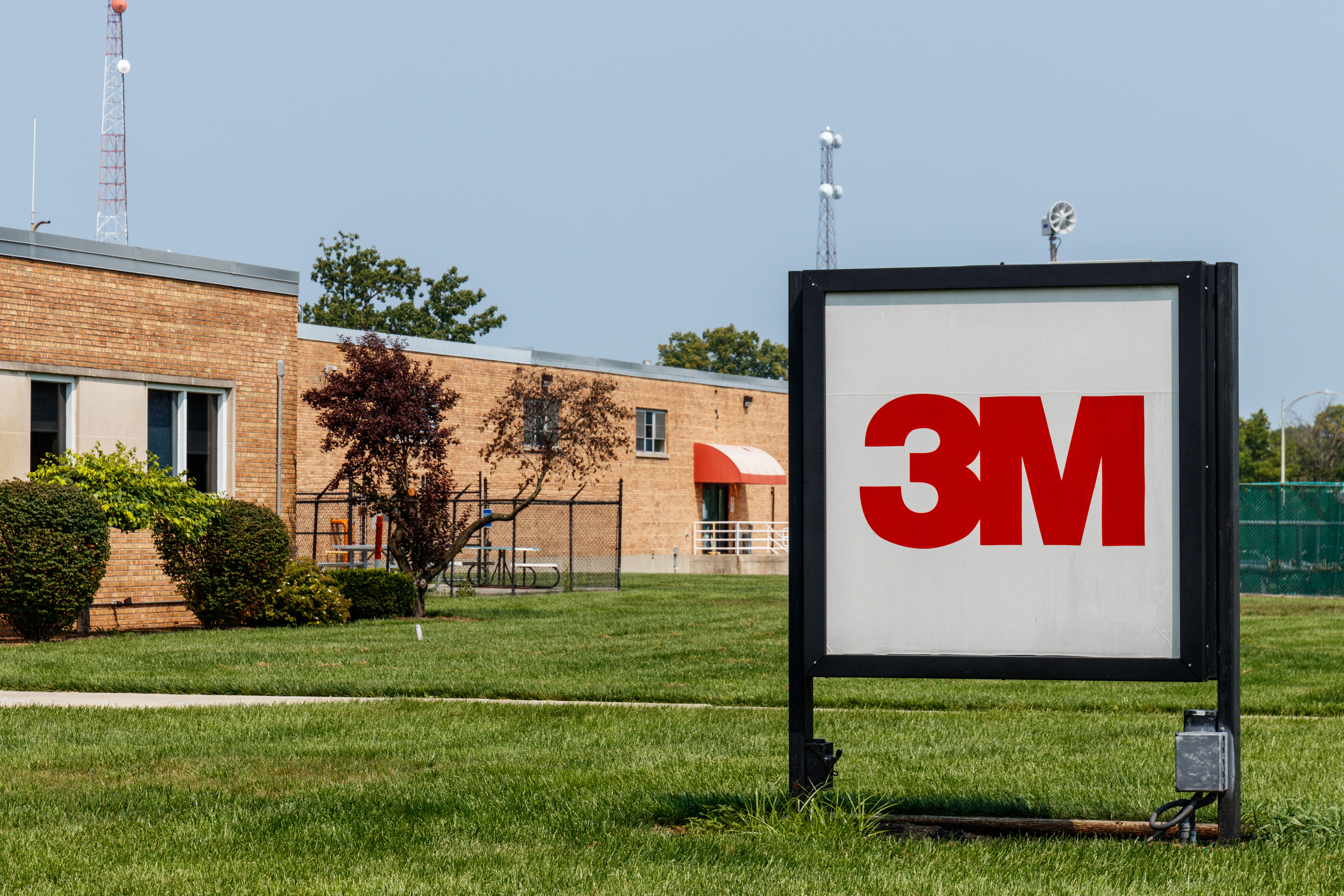 3M company logo on outdoor sign in front of brick facility building
