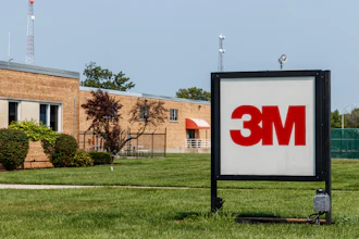 3M company logo on outdoor sign in front of brick facility building