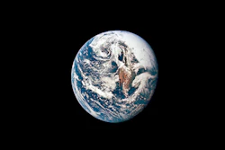 Earth viewed from space showing blue oceans, white clouds, and continental landmasses against black background