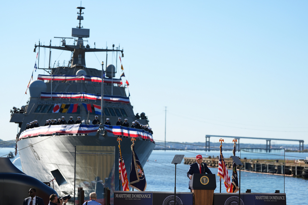 USCGC Maritime Dominance naval vessel at commissioning ceremony with officials and American flags at waterfront dock