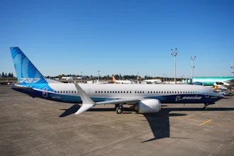 Boeing 737 commercial aircraft parked at airport with blue and white livery