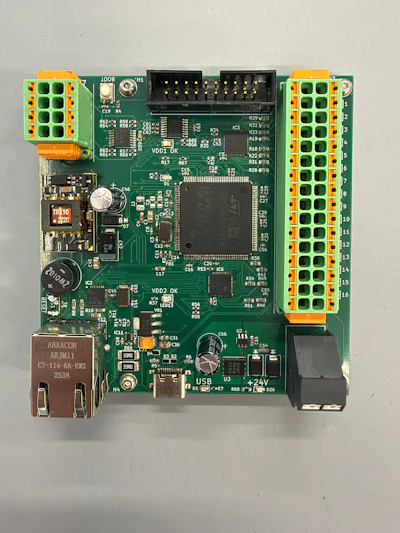Industrial control circuit board with green PCB, orange terminal blocks, integrated circuits, and USB connector
