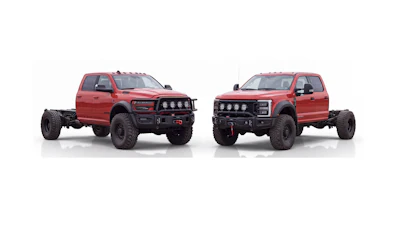 Two red lifted pickup trucks with custom front bumpers and roof lights displayed side by side