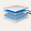 Exploded view diagram of mechanical keyboard switch layers showing white top cap, blue housing, gray switch stem, and electrical connectors