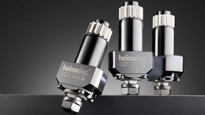 Three metallic Helmolux industrial pressure cartridge vessels with silver and black finishes displayed against dark background
