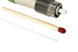 Fiber optic connector with green cable, metallic coupling nut, and ceramic ferrule tip displayed with applicator tools