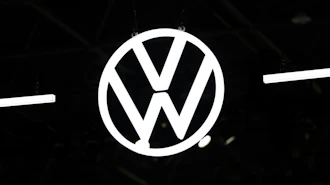 Volkswagen logo emblem illuminated against dark background